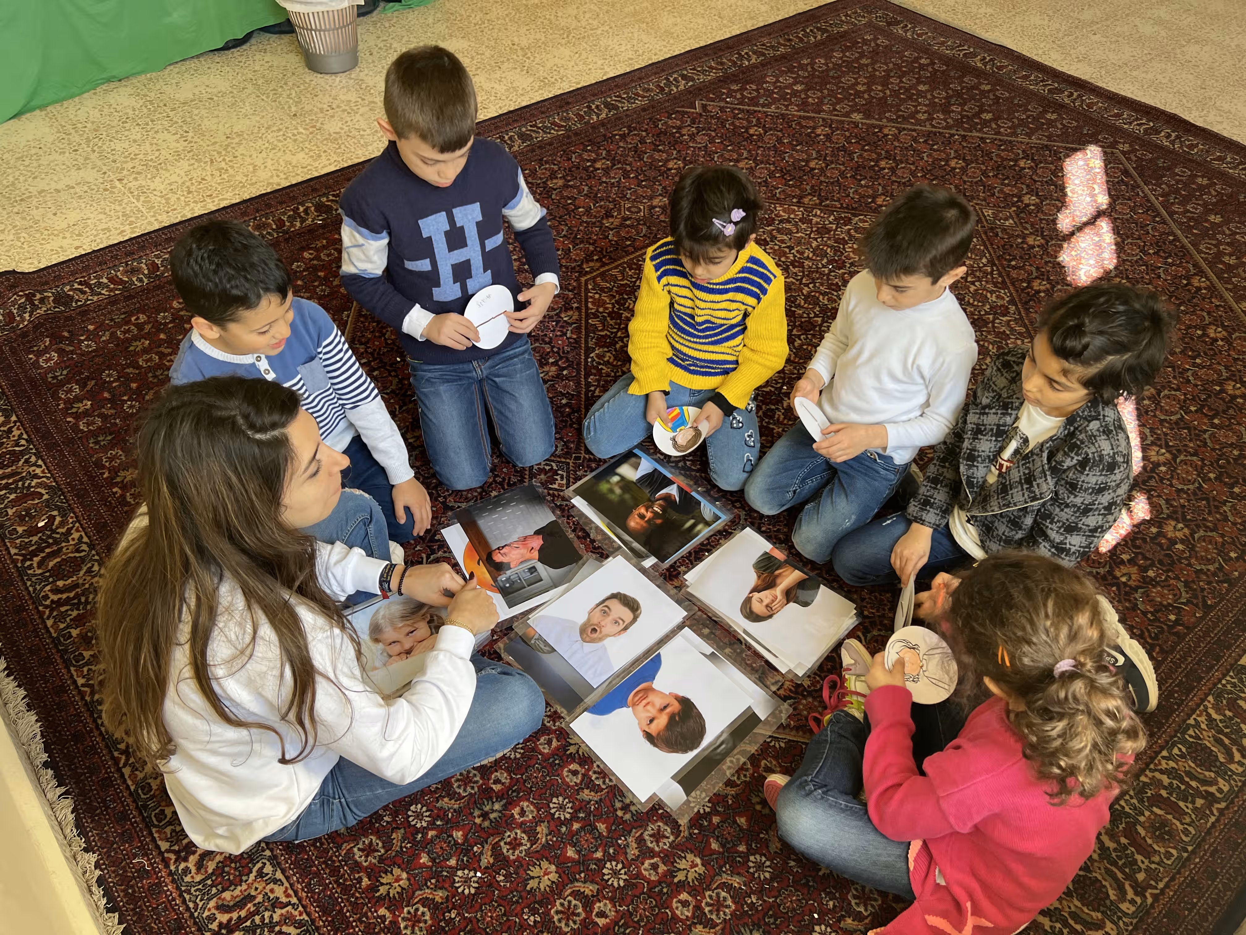 Photograph illustrating EMERGE's "Child focused psychosocial support" response for children at risk